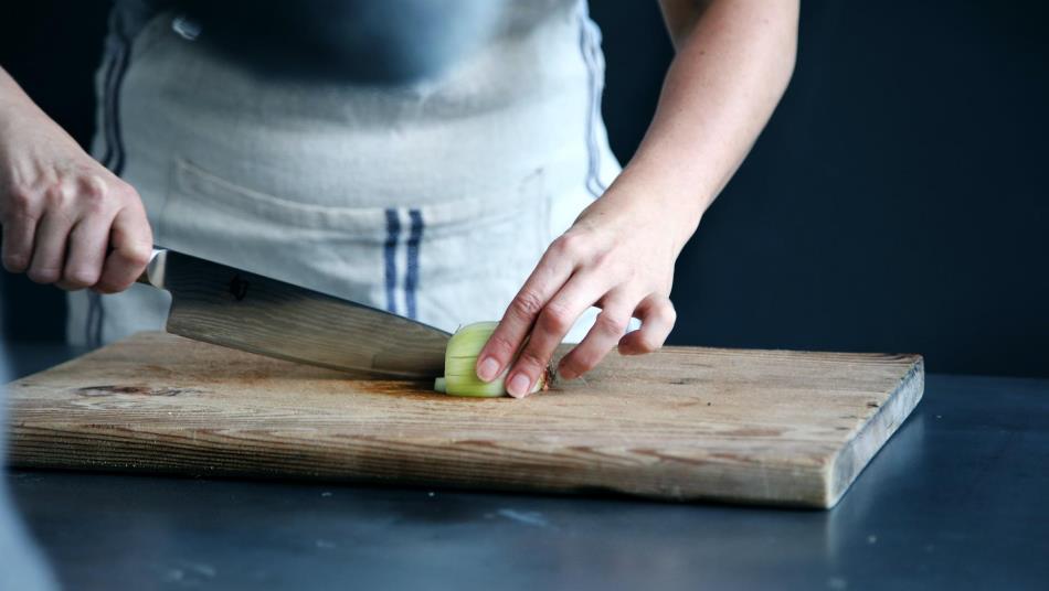 Cutting Onion on Cutting Board Image