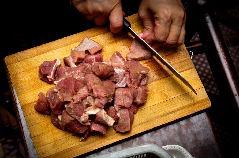 Cutting meat on maple cutting board