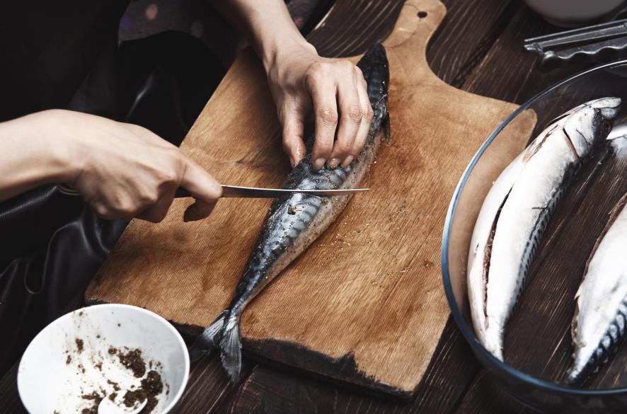 Fillet knife working on a fish