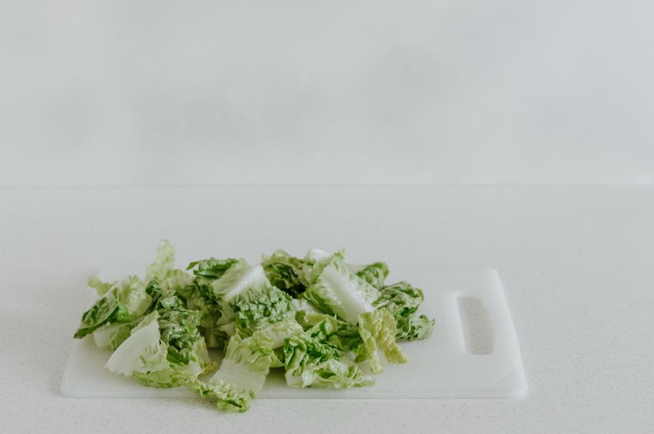Vegetable on top of a plastic cutting board