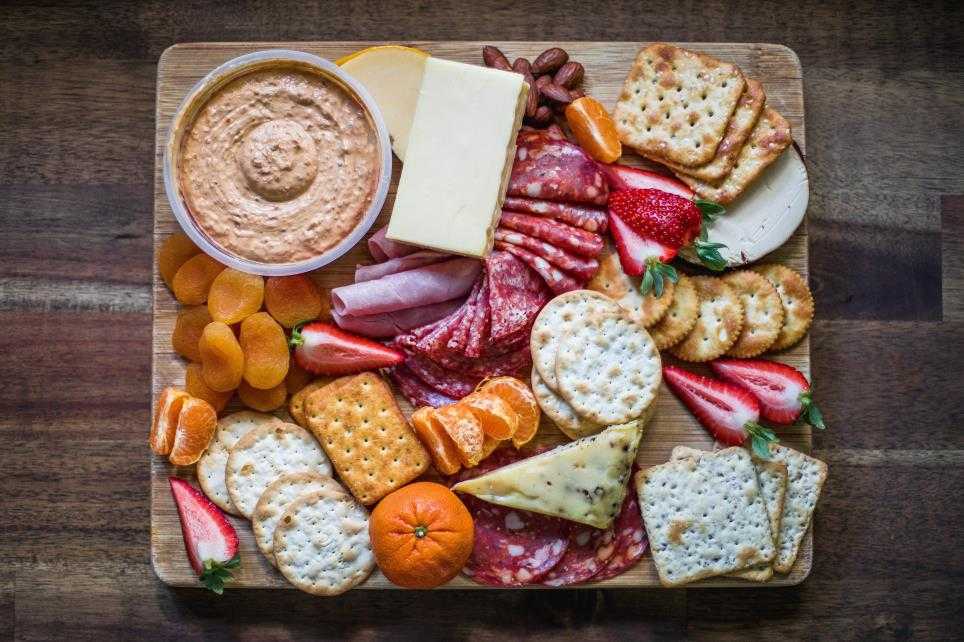 Charcuterie plate with crackers and snacks