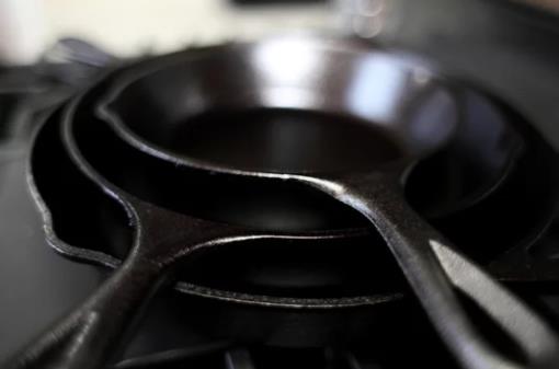 Different sizes of cast iron skillets