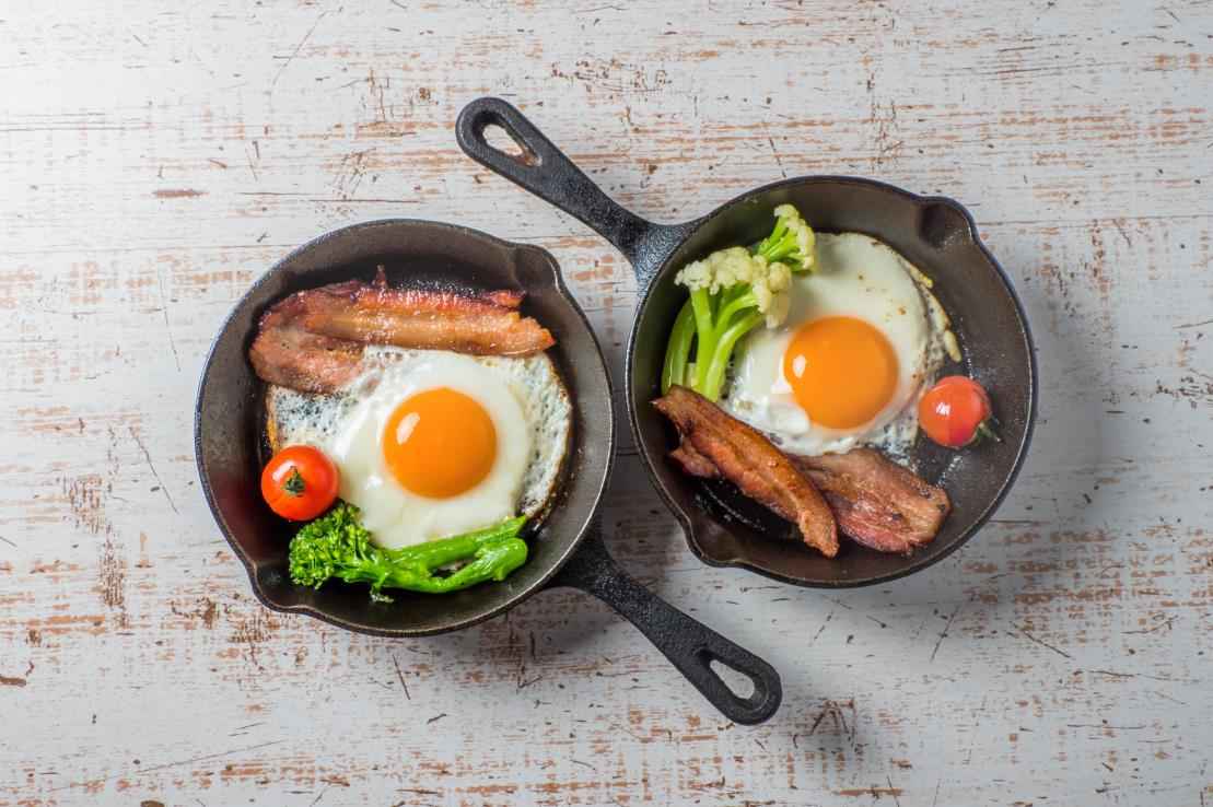 Bacon and eggs on cast iron skillets