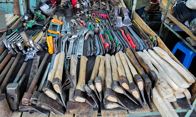 Various axes are placed on a workbench.
