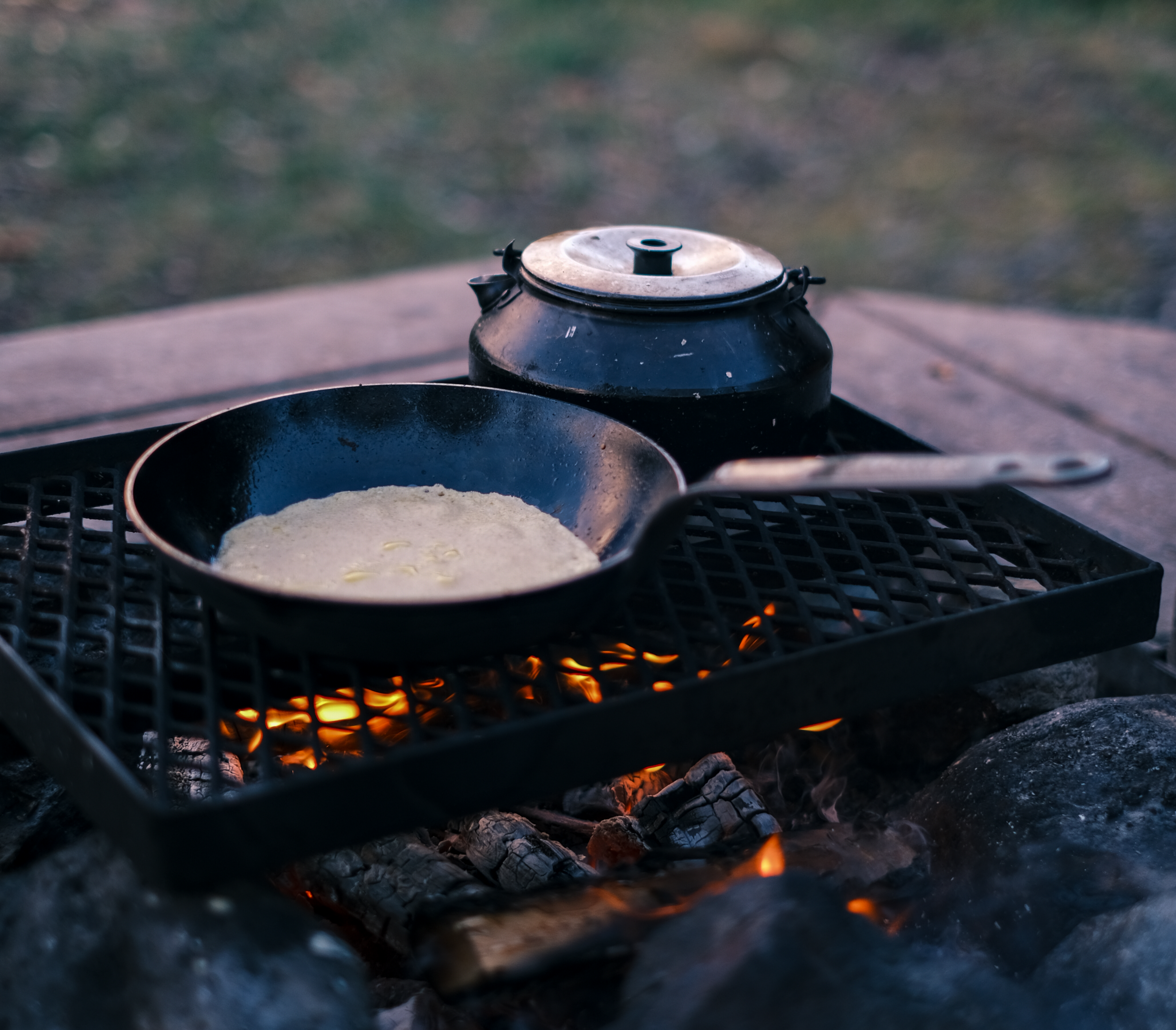 The Ultimate Guide to Cast Iron Campfire Cooking: Equipment, Techniques & Maintenance