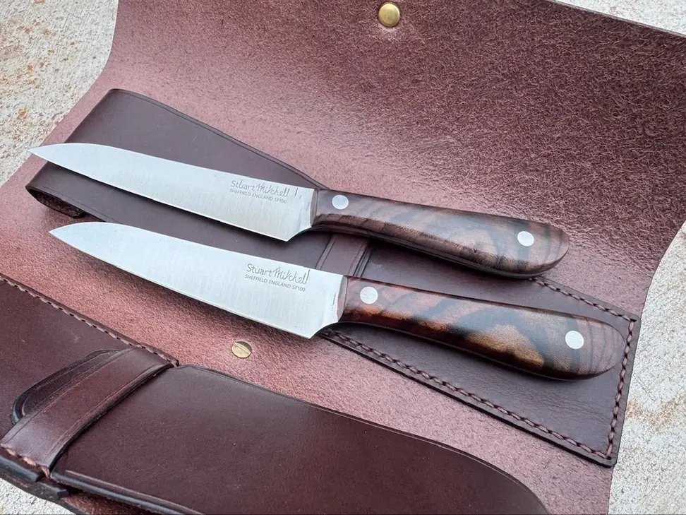 Two Stuart Mitchell rosewood-handled kitchen knives in a leather roll